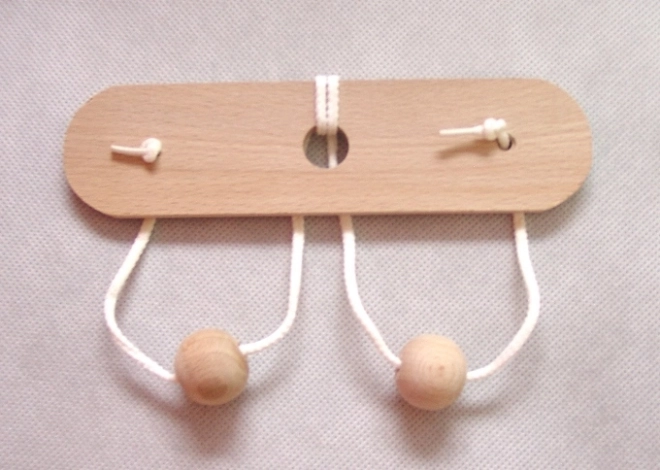 Casse-tête en bois Seins