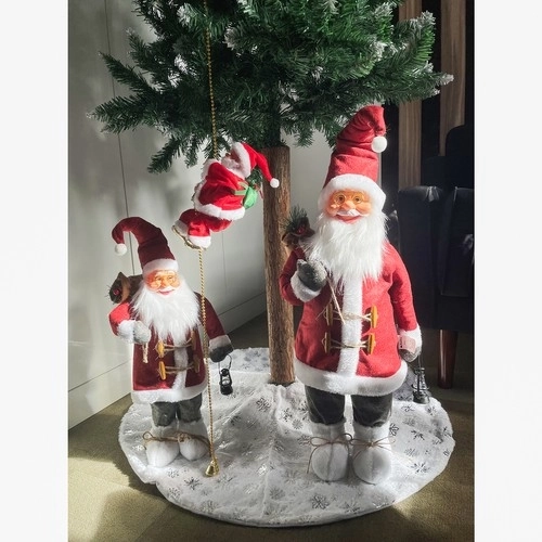Saint Nicolas grimpant sur une corde dorée - décoration de Noël