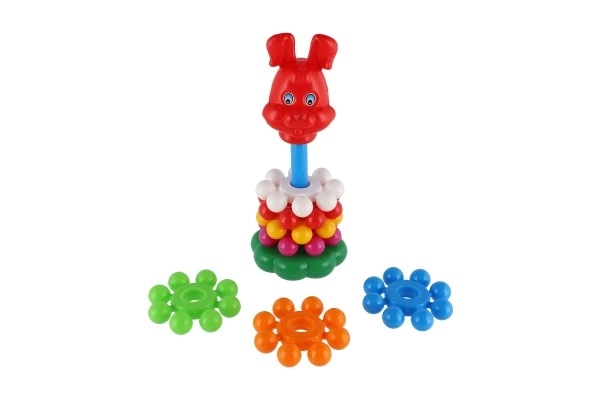 Puzzle pyramide avec anneaux en plastique 26cm dans un filet 12m+