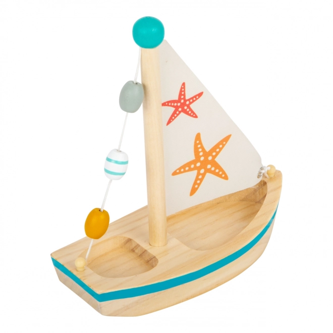 Petit bateau à voile en bois étoile de mer