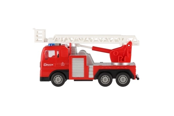 Voiture de pompiers en plastique 16cm à inertie avec batterie avec lumière et son dans une boîte 21x13x9cm