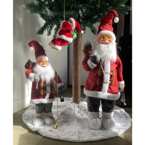 Saint Nicolas grimpant sur une corde dorée - décoration de Noël