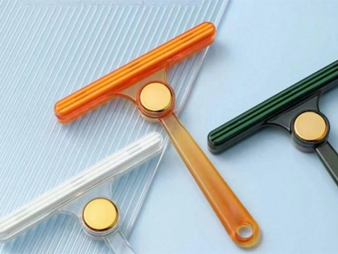Brosse réversible pour éliminer les poils de chien des tapis