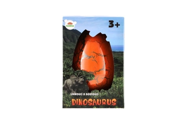 Œuf avec dinosaure éclosant