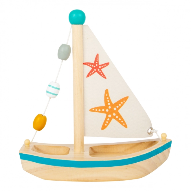 Petit bateau à voile en bois étoile de mer