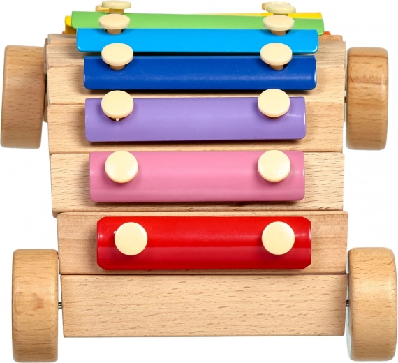 Jouet roulant et instrument en un