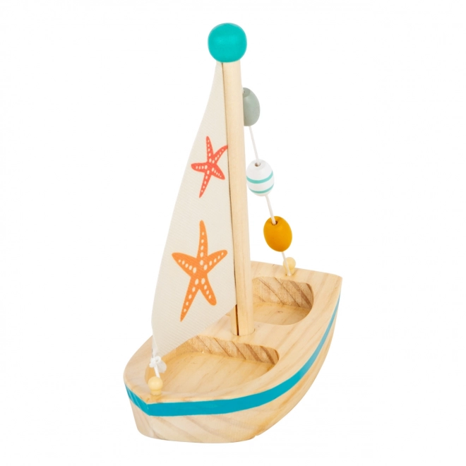 Petit bateau à voile en bois étoile de mer