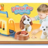 Chien en peluche avec caisse de transport et accessoires