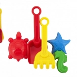 Set en plastique pour le sable avec pelle, râteau et moules dans un filet